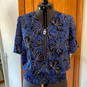 Beautiful flowing blouse with gold detail.  Lightweight, dresses up any outfit